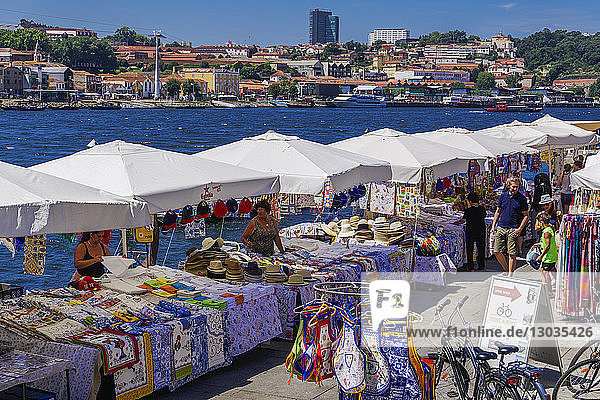 Open air street stalls and markets with cork and gift products on Douro River bank in Ribeira District  Porto  Portugal