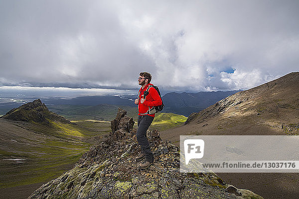 Side view shot of a male hiker standing in Skaftafell National park  Iceland