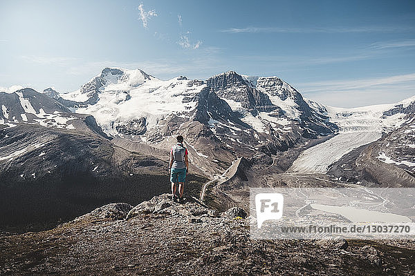 Female hiker admiring scenic view of Athabasca peak and glacierâ€ from Wilcox Pass  Alberta  Canada