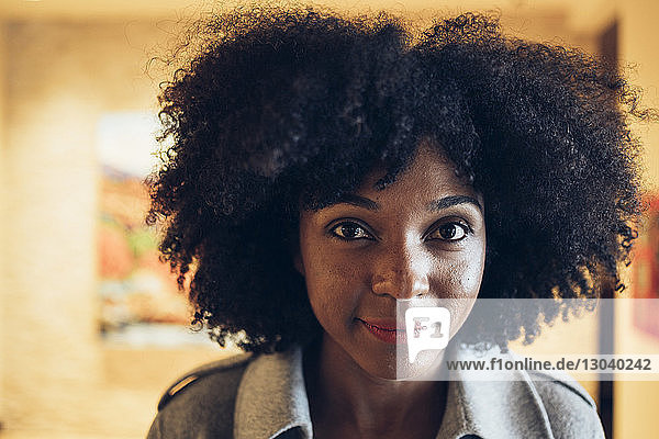Close-up portrait of confident businesswoman in hotel