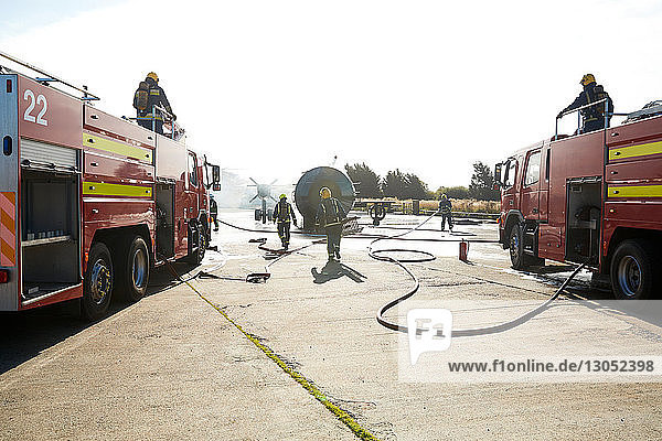 Firemen putting out fire on old training aeroplane  Darlington  UK