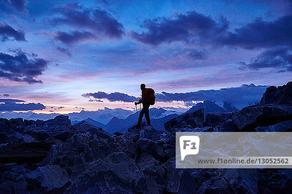 Hiker at dusk  Mont Cervin  Matterhorn  Valais  Switzerland