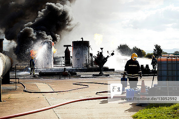 Firemen training to put out fire on burning tanks  Darlington  UK