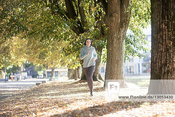 Cross country jogger running in park
