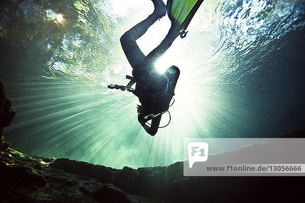 Low angle view of scuba diver in sea