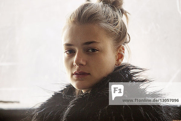 Portrait of woman in black fur coat
