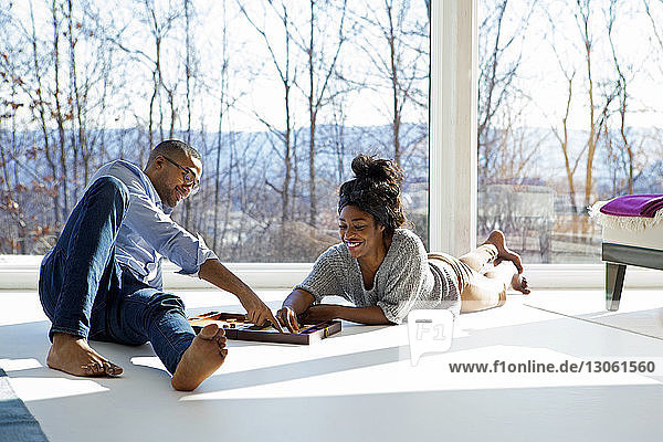 Couple enjoying backgammon game at home