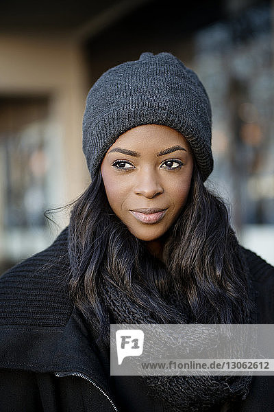 Close-up of young woman wearing knit hat