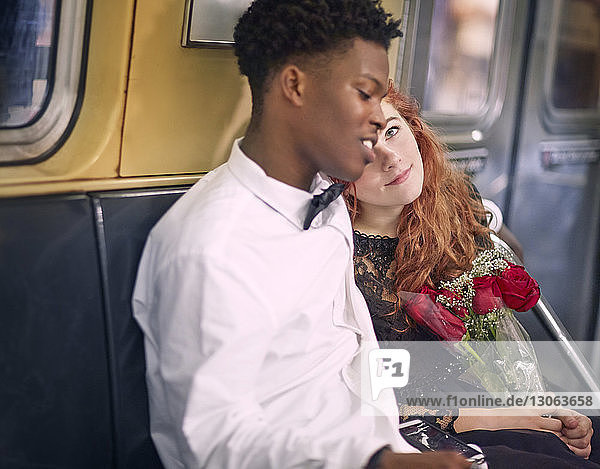 Couple traveling in train