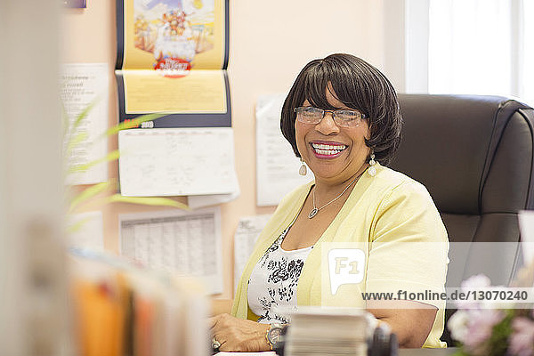 Portrait of happy businesswoman in office
