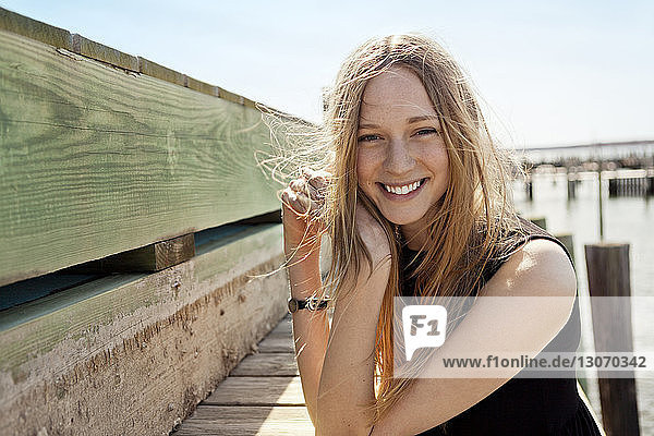 Portrait of smiling woman at pier
