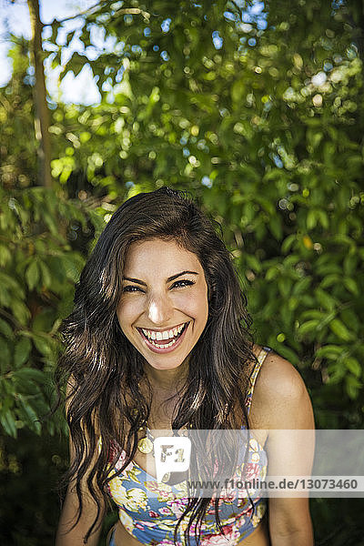Portrait of happy woman in backyard