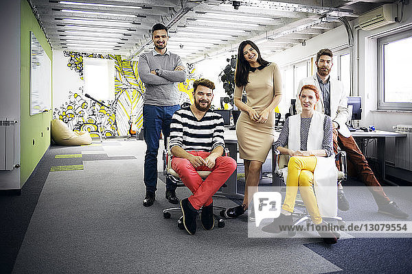 Portrait of confident business team in creative office