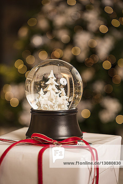 Close-up of snow globe on Christmas present