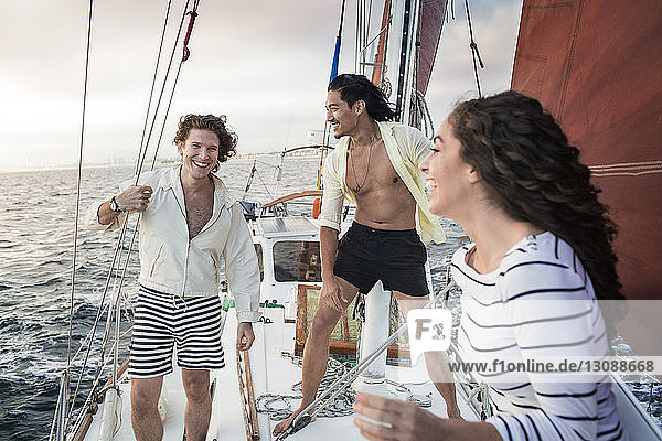 Friends enjoying on sailboat