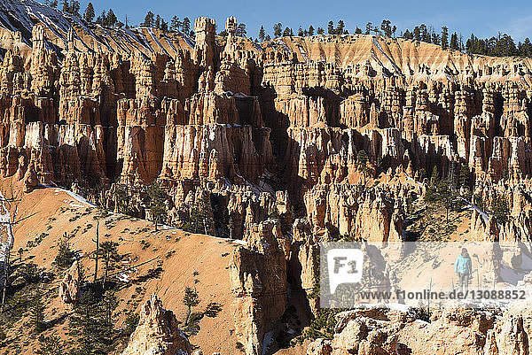 High angle view of female hiker hiking on rock formations at Bryce Canyon National Park