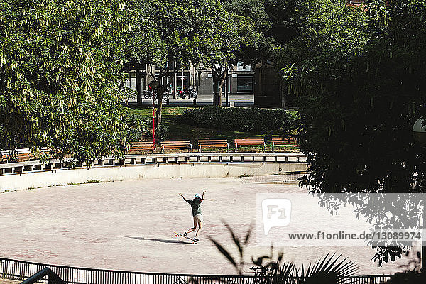 High angle view of woman skateboarding at park