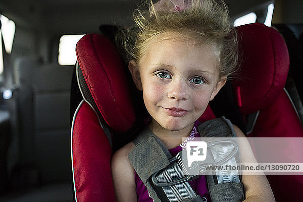 Portrait of smiling girl traveling in car