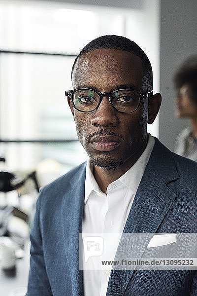 Portrait of confident businessman wearing eyeglasses in office