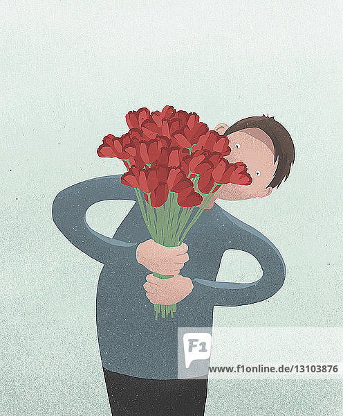 Mann hält roten Tulpenstrauß zum Valentinstag