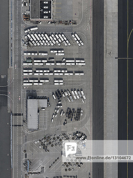 Aerial view buses and cars parked at airport