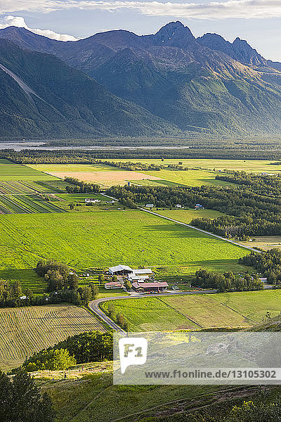 Elevated view of farmland below the Butte and Goat Mountain in Palmer  South-central Alaska; Palmer  Alaska  United States of America