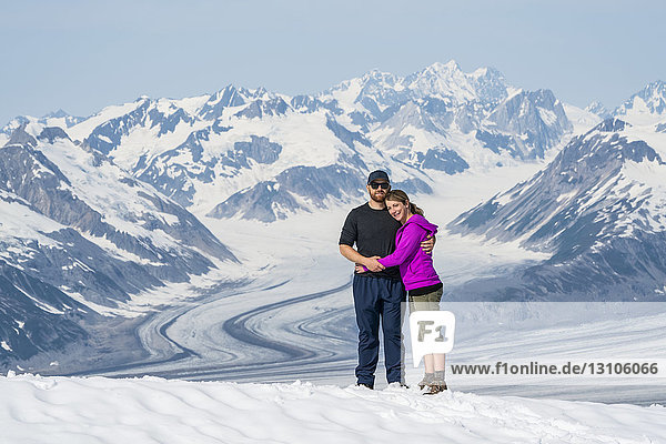 A couple enjoy the sights and scenery of Kluane National Park and Reserve on a bright sunny day; Haines Junction  Yukon  Canada