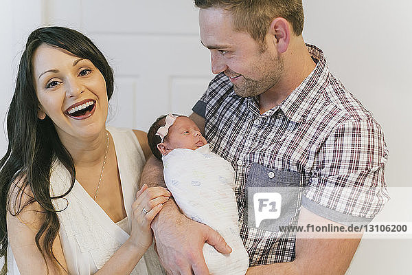 Portrait of a family with a newborn baby girl; Surrey  British Columbia  Canada