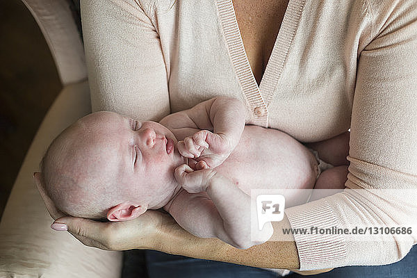 A mother holds a newborn baby; Surrey  British Columbia  Canada