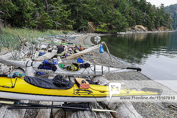 Kayaks on a small Islet at Beaumont Marine Park in Bedwell Harbour South Pender Island; Pender Island British Columbia Canada.