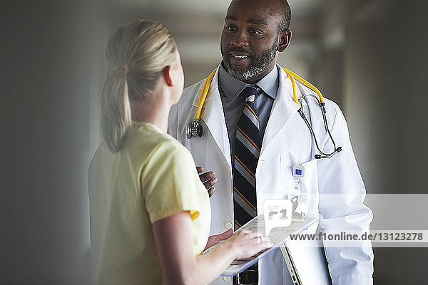 Doctor and nurse discussing in hospital