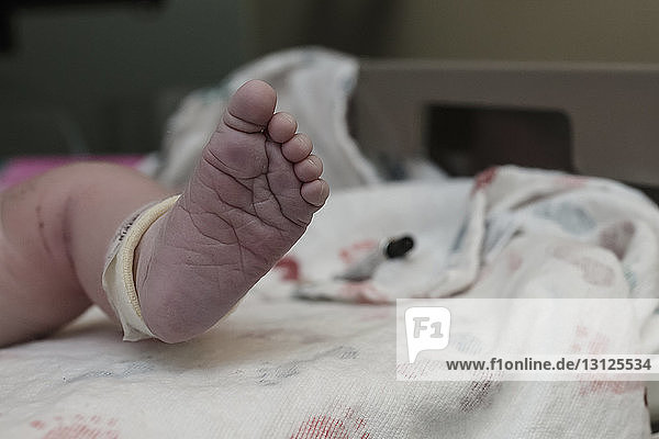 Low section of newborn baby at hospital