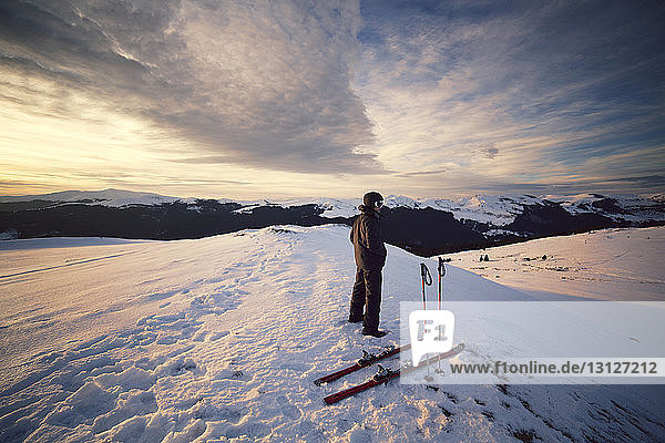Skier looking at view while standing on Carpathian mountain