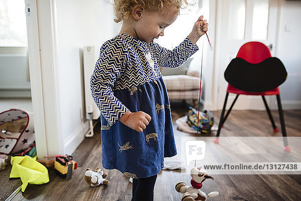 Girl playing with toys at home