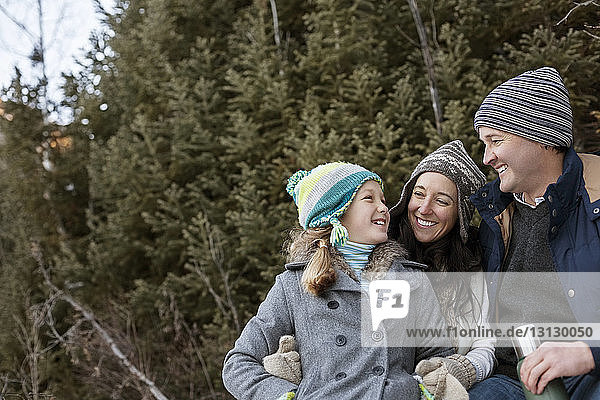 Happy family enjoying vacation in forest