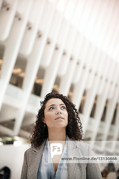 Thoughtful businesswoman in modern building