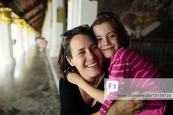 Close-up of cheerful woman with daughter