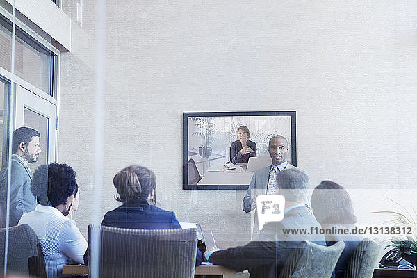 Businessman explaining colleagues during meeting in conference room