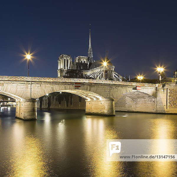View of Notre-Dame Cathedral and river Seine at night  Paris  France