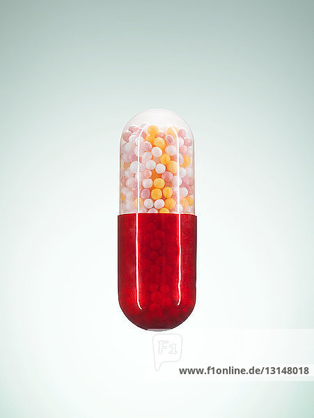 Red and transparent pill capsule