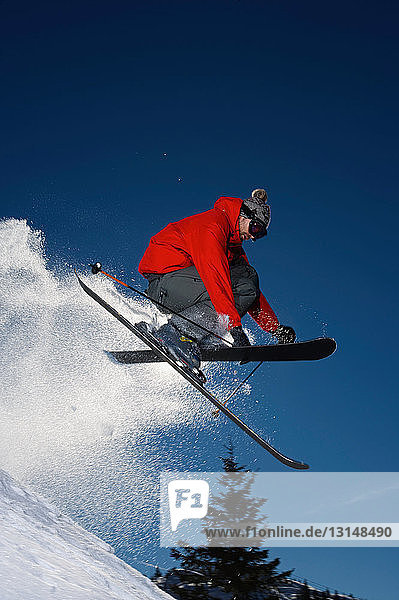 Skier jumping into the air.