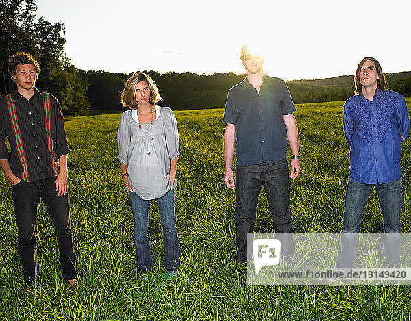 Group of people standing in a field