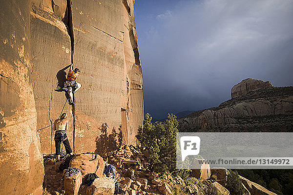 'Two women climbing ''Gorilla'' 5.10+ - Indian Creek  Utah  USA'