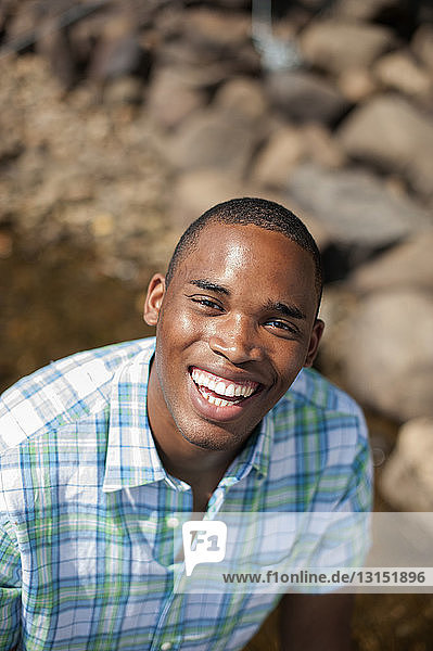 Portrait of young man wearing checked shirt