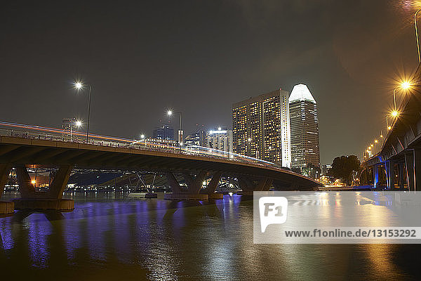 View of bridge and skyscrapers at night  Singapore