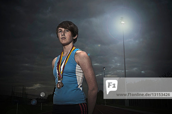 female athlete with medals