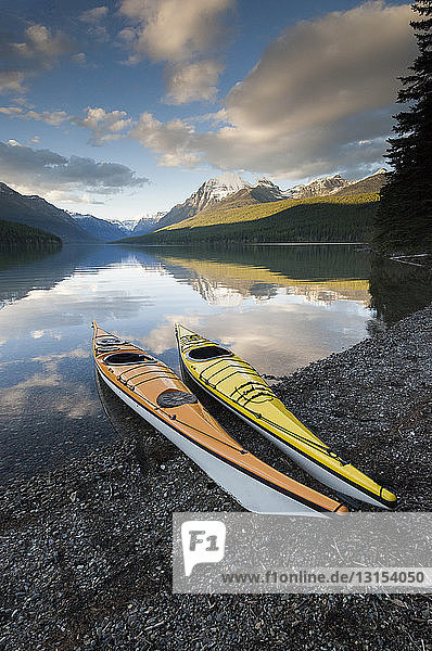 Two kayaks on shore of St. Mary Lake  Glacier National Park  Montana  USA