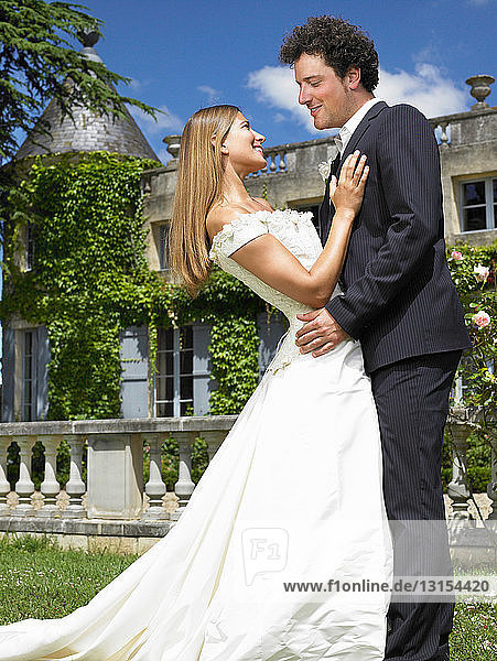 Newlyweds in front of castle