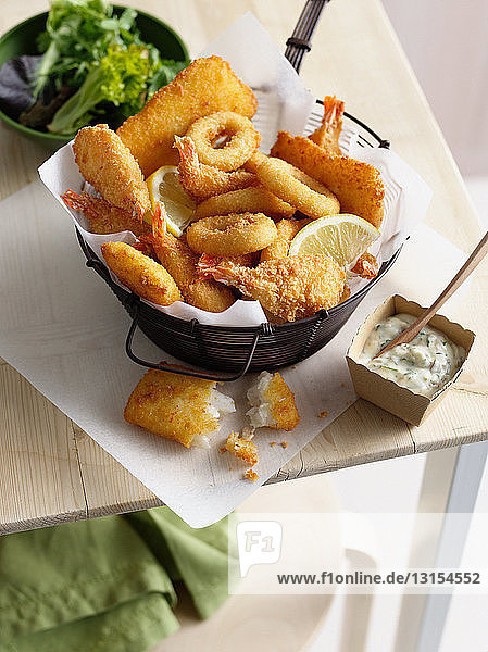 Bowl of onion rings and fried prawns