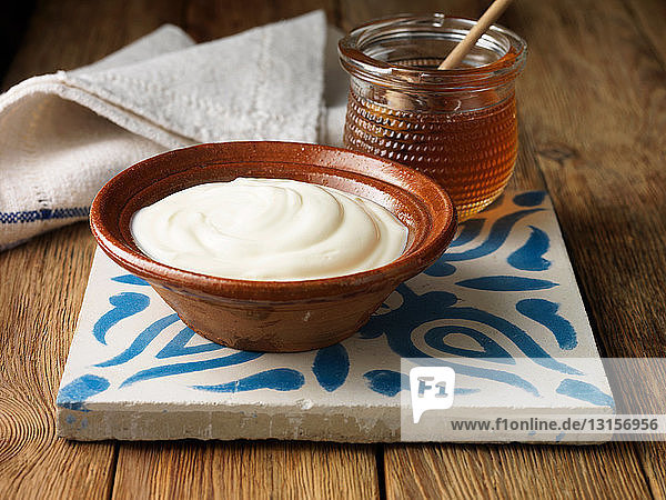 Greek yogurt and honey on tile